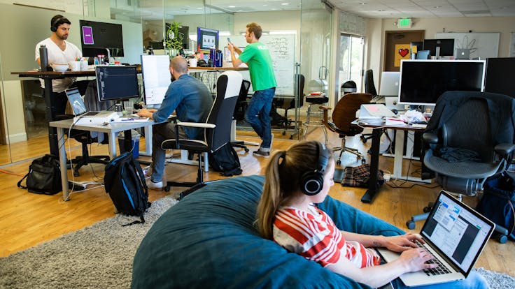 A typical day in the office, featuring Brandon, Harry, Brad & Hannah each buried in their own tasks