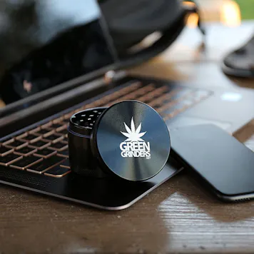 Photo of 2.5" 4 Piece Aluminum Herb / Weed Grinder - By GreenGrinders Carrying Pouch & Kief Scraper Included