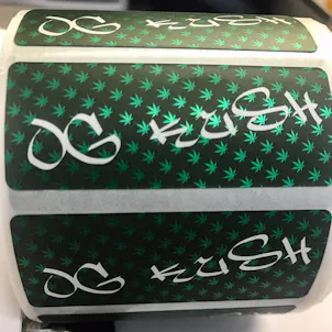 Photo of Marijuana Plant Label on silver metallic material