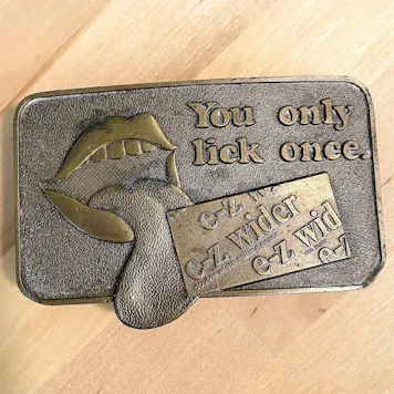 Photo of vintage e-z wider rolling papers belt buckle